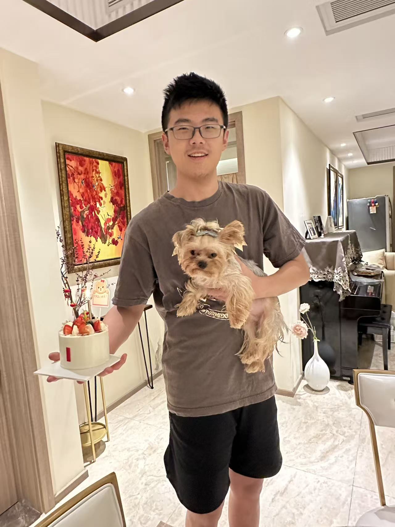 Founder with his dog and cake